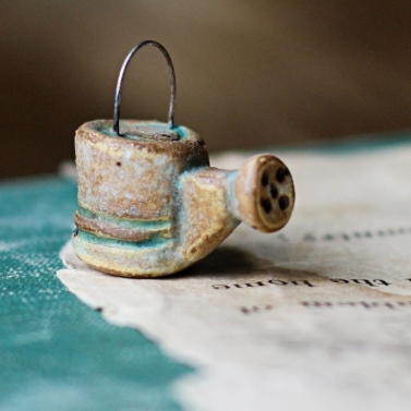 tiny weathered watering can 